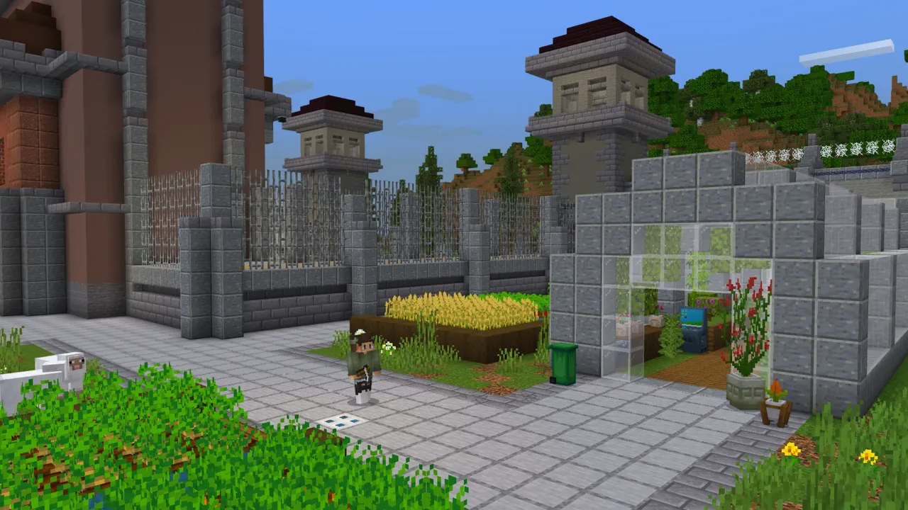 Gated courtyard entrance with a fountain, flower bed and stone pathways in the Ultimate Police Base Minecraft Bedrock add-on