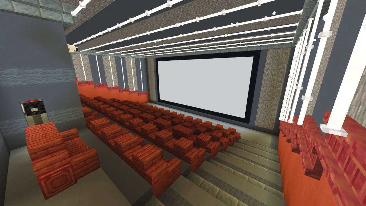 Home theater room with red seating and a large screen in Minecraft Bedrock.