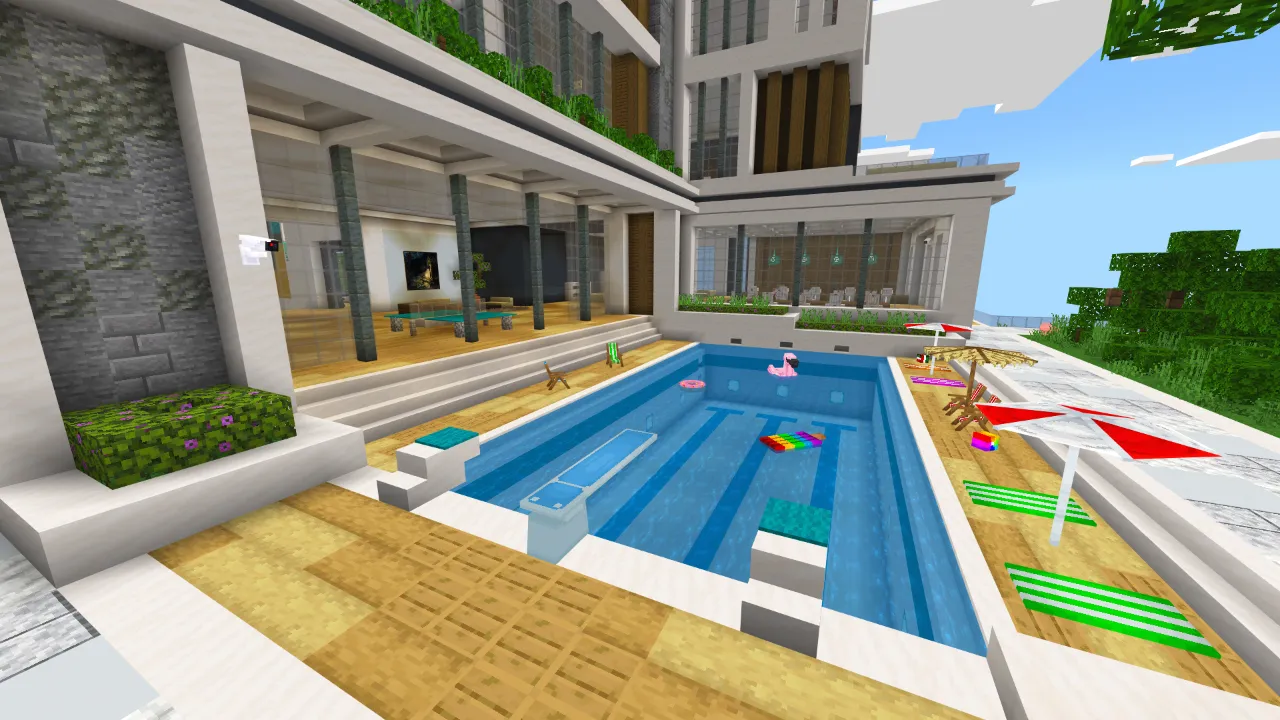 Swimming pool area with lane markers next to the modern mansion in Minecraft Bedrock.